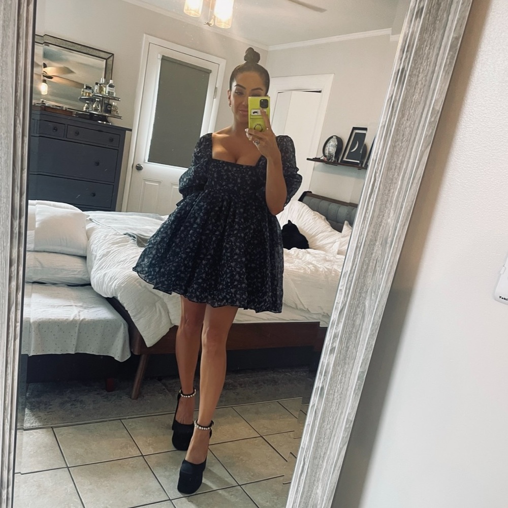 Black babydoll dress with purple flowers.